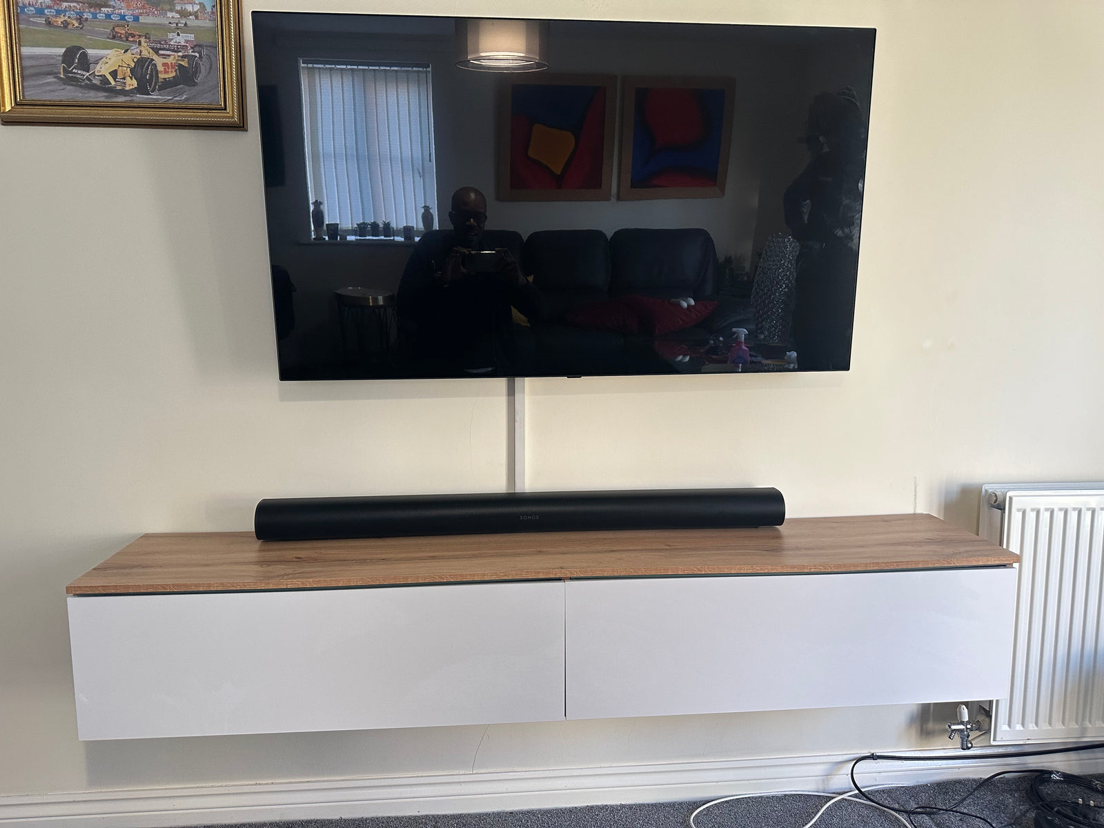 Completed wall-mounted TV installation with cable management by Okey Solutions